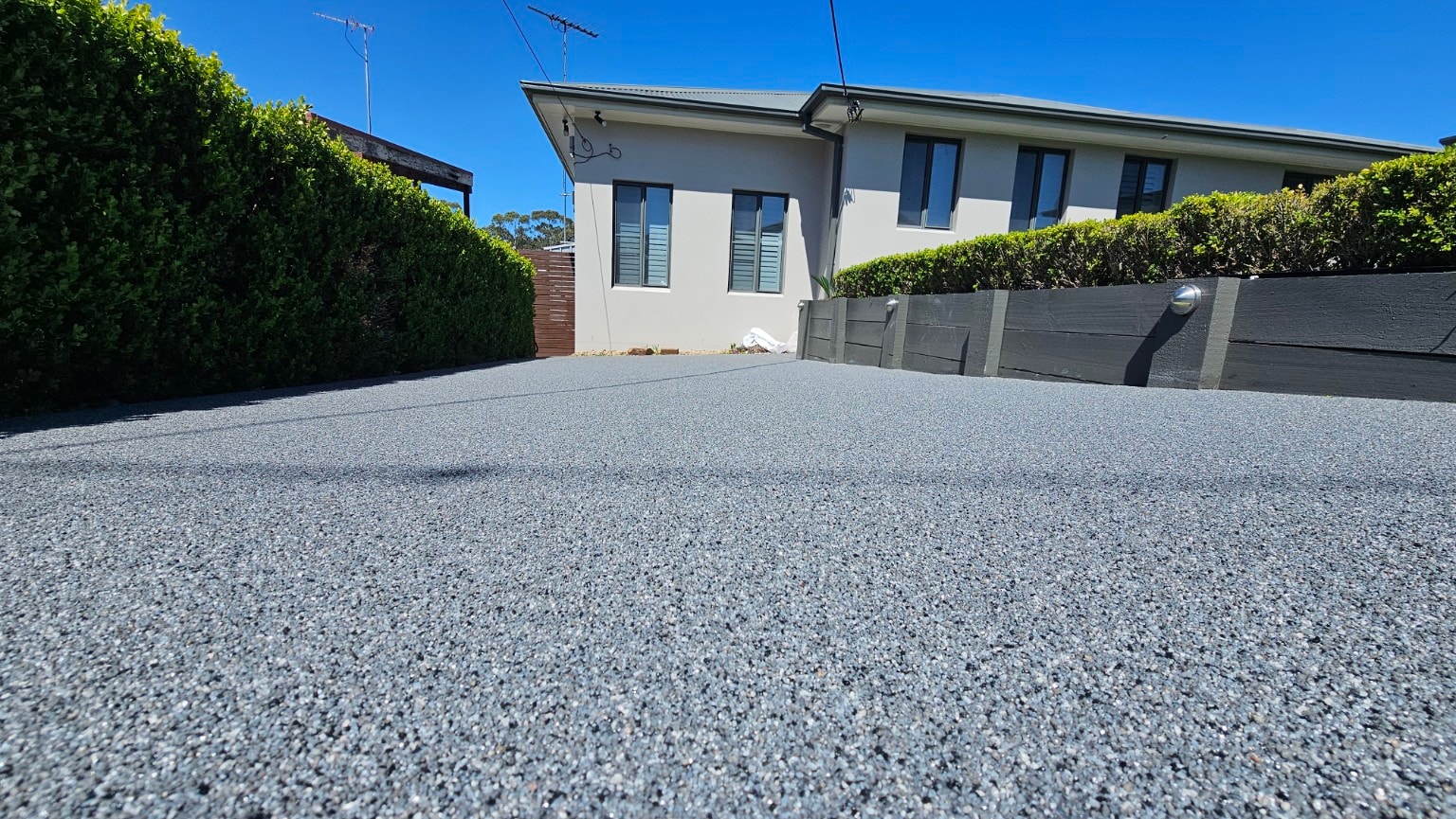 Second driveway finished with epoxy quartz broadcast