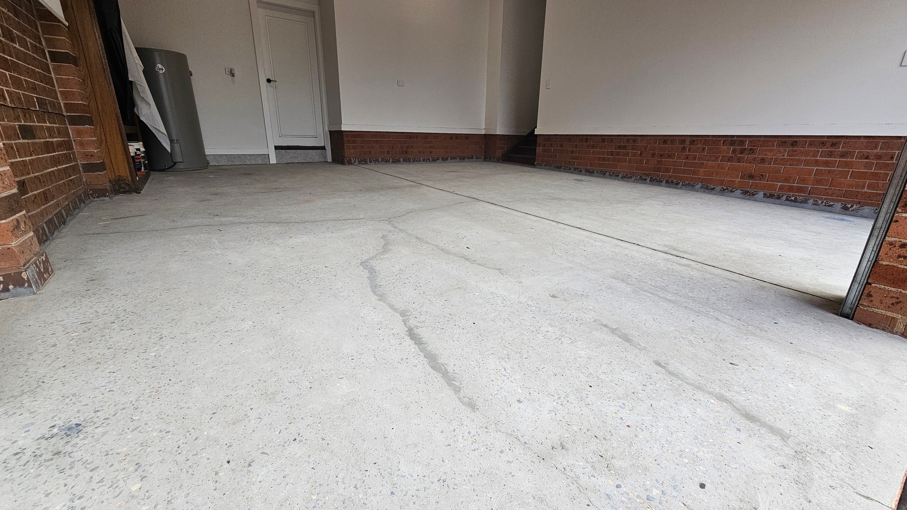Clean ground concrete garage floor after paint removal